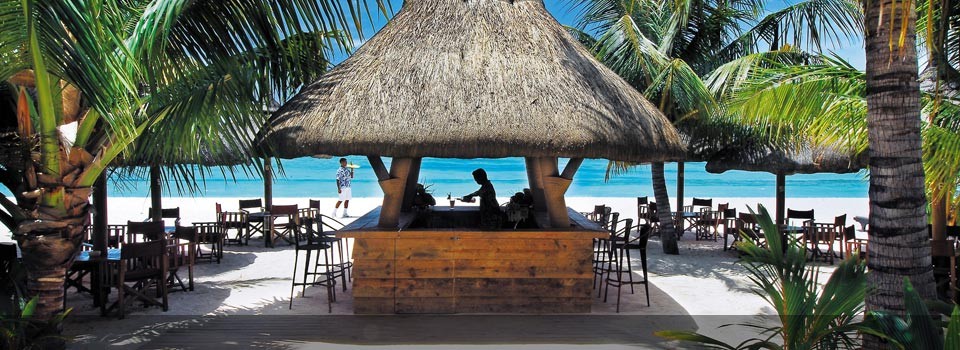 Enjoy a Drink at the Dinarobin Hotel & Spa Beach Bar