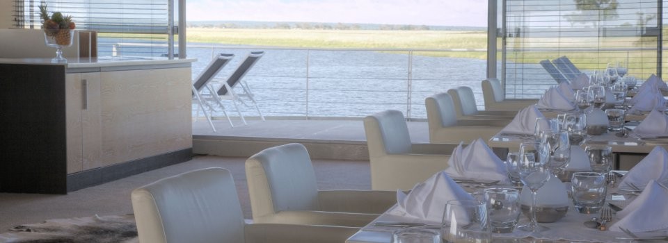 Dine in style on the luxury Zambezi Queen houseboat on the Chobe River.