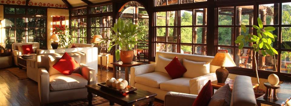 Relax in one of the guest lounges at Sanctuary Olonana Lodge