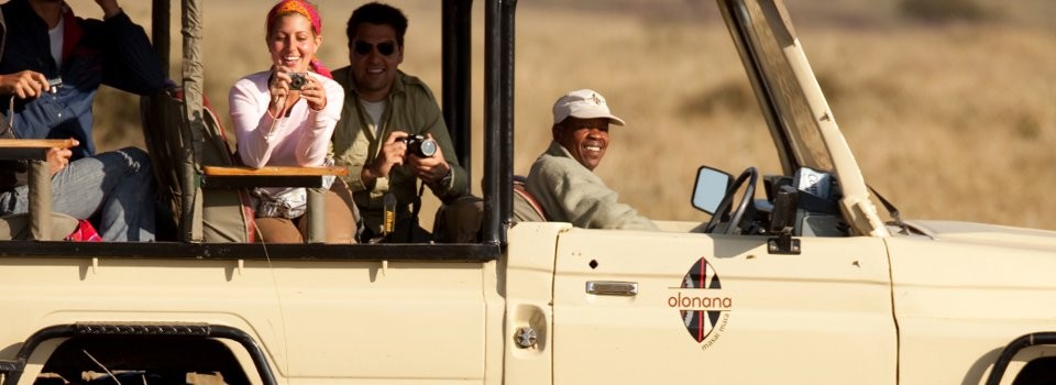 Guests enjoy a game drive in the Masai Mara at Sanctuary Olonana Lodge