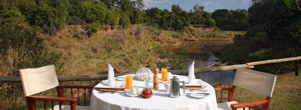 Dining on the river at Governors' Il Moran Camp