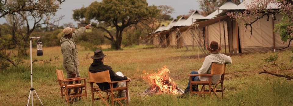 Fire-side dining at Singita Explore in the Serengeti